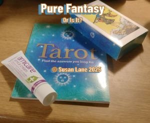 Tarot cards and healing cream on wooden surface—fantasy meets reality in Susan Lane’s poetic reflection overlaid with text "Pure Fantasy or is it?" and "© Susan Lane 2025"